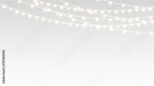 Garland glowing festive christmas decoration ribbons and bulbs over holiday stage.
