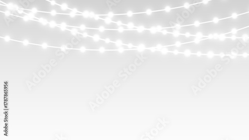 Garland decorated with glowing festive lights ribbons and bulbs for christmas holiday stage.
