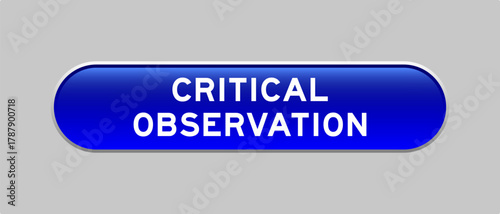 Blue color capsule shape button with word critical observation on gray background