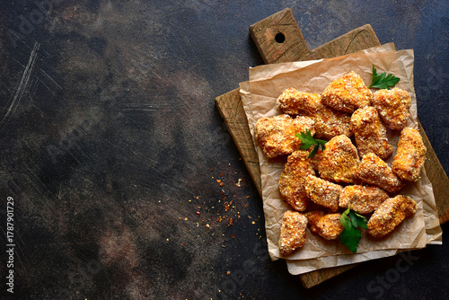 Fresh  homemade crispy chicken nuggets with ketchup . Top view with copy space.