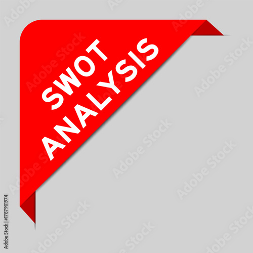 Red color of corner label banner with word SWOT (abbreviation of strength, weakness, opportunities, threats) analysis on gray background