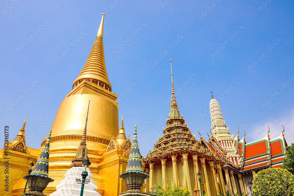 Fototapeta premium Wat Phra Kaew or Wat Phra Sri Rattana Satsadaram is temple used for various royal ceremonies during reign of King Rama I. It is temple within the Grand Palace. Inside temple is the Emerald Buddha.