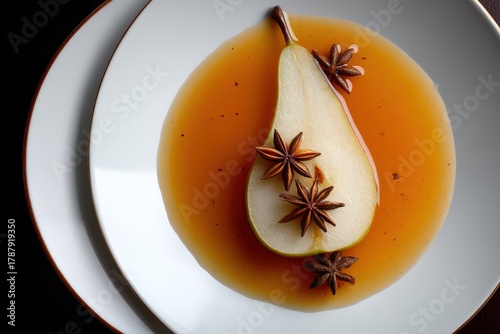 Elegant pear dessert infused with aromatic spices displayed artfully on a contrasting plate highlighting culinary creativity and gourmet presentation captured with clarity