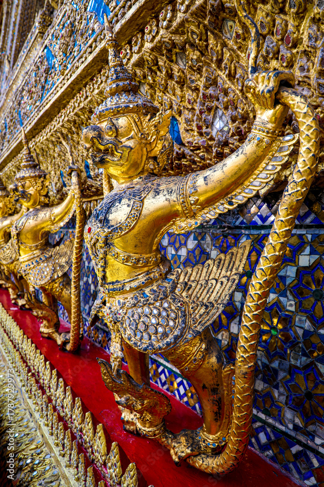 Obraz premium Wat Phra Kaew or Wat Phra Sri Rattana Satsadaram is temple used for various royal ceremonies during reign of King Rama I. It is temple within the Grand Palace. Inside temple is the Emerald Buddha.