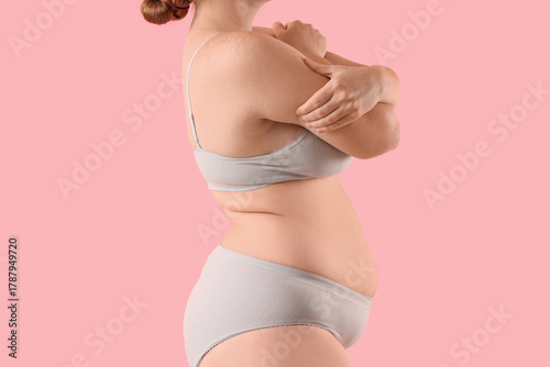 Overweight woman in underwe...