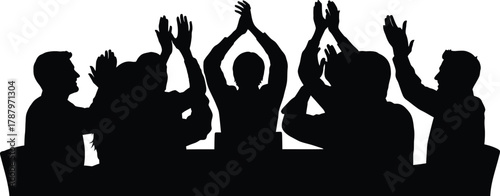 Group of diverse people silhouette raising hands and clapping in celebration at a meeting or successful business event