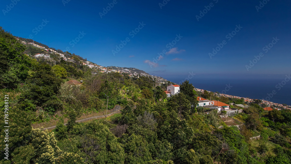 Fototapeta premium Aerial view from the mountain over the rooftops from cable car on Madeira timelapse hyperlapse.