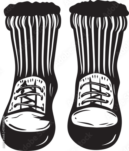 A pair of black and white socks with a striped pattern, worn by a person in a white shirt and black pants.