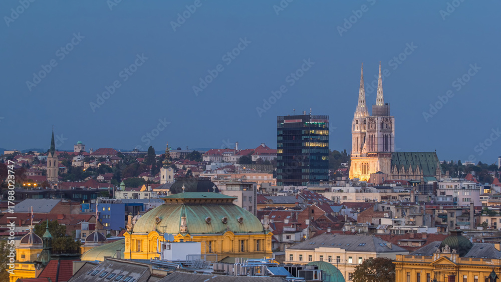 Fototapeta premium Zagreb cathedral and modern skyscraper with a old city panorama day to night timelapse