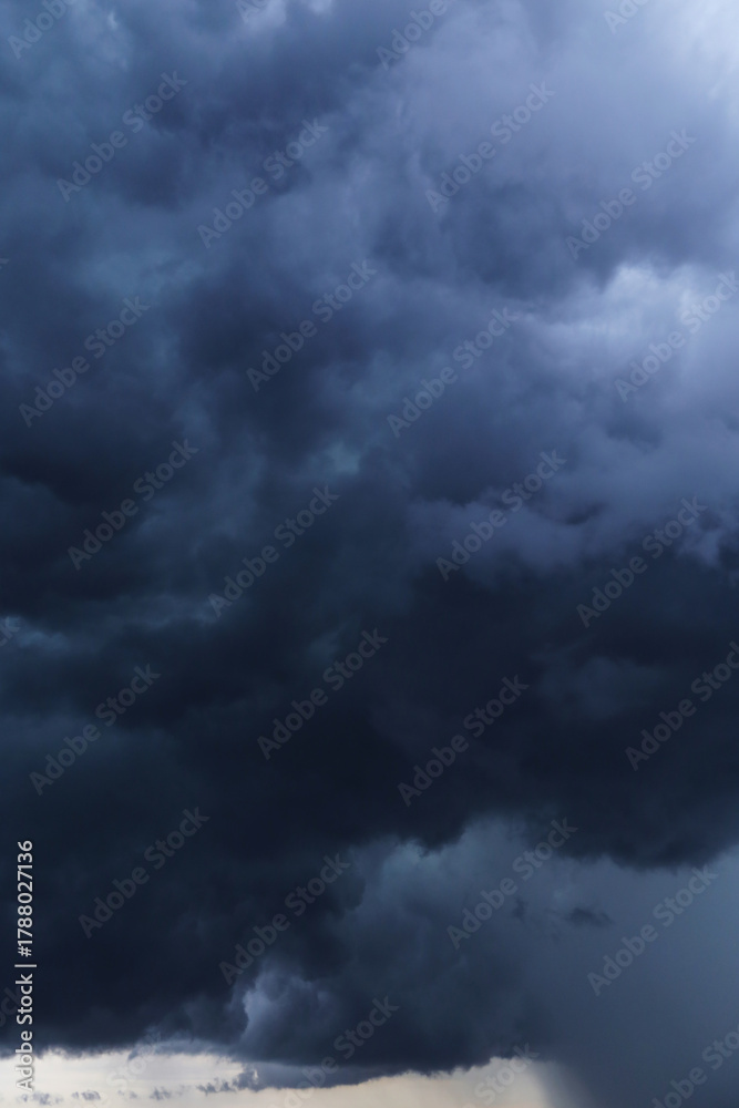 Fototapeta premium Epic Dramatic Storm sky with dark blue cumulus rainy cloud abstract background texture, thunderstorm