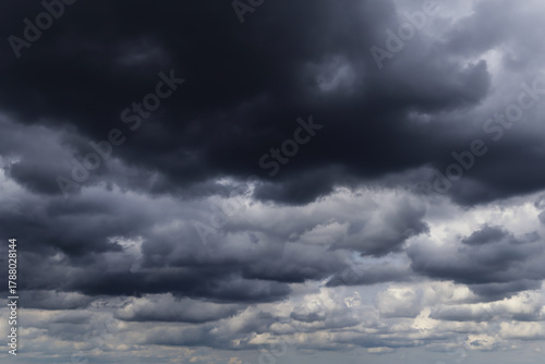 Epic Dramatic Storm sky with dark grey cumulus rainy clouds abstract background texture, thunderstorm