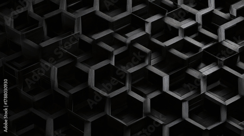 Abstract honeycomb structure in shades of gray, showcasing a 3D hexagonal pattern