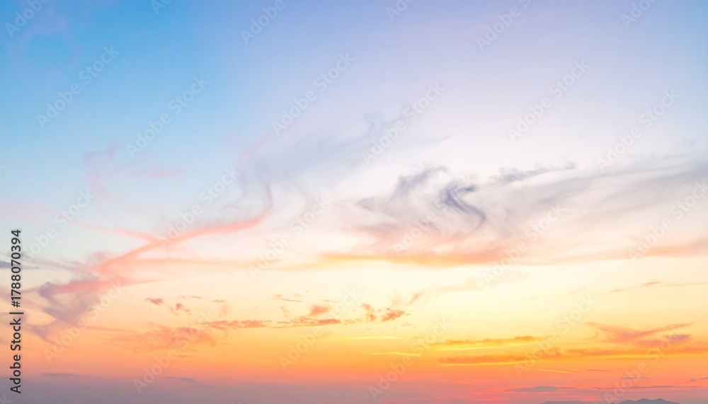 Fototapeta premium Gentle pastel sky with soft clouds at sunrise for background or wallpaper design and peaceful concepts.