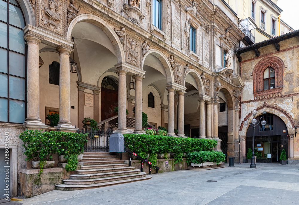 Fototapeta premium View of medieval square Piazza dei Mercanti in Milan, Italy. Cozy cityscape of Milan. Architecture and landmarks of Milan.