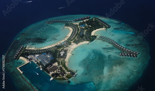 Fototapeta Naklejka Na Ścianę i Meble -  Aerial View of Luxury Resort Island with Overwater Villas