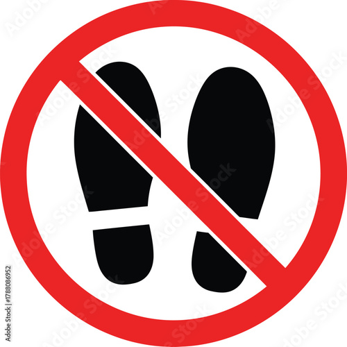 No footprints allowed sign, red circle with diagonal line over two black shoe prints, symbol for prohibition and restricted access, do not walk here, danger zone, keep off area