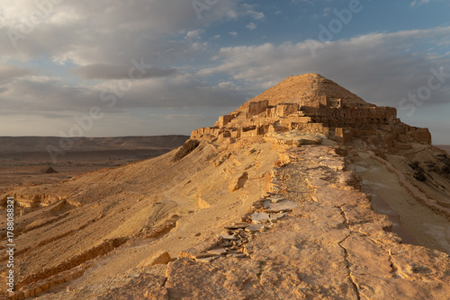 Fototapeta Sunset at the Old defensive site Ksar Guermessa dominating the plain of El Ferch