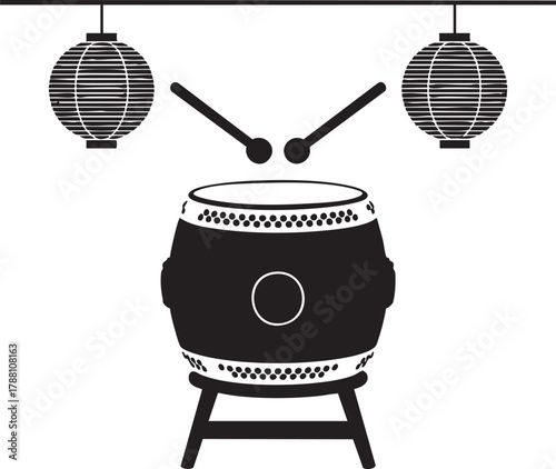 Japanese taiko drum stands ready with lanterns and drumsticks in stark black and white