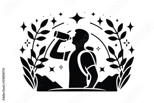 Silhouette of a hiker pauses to drink from his water bottle surrounded by nature