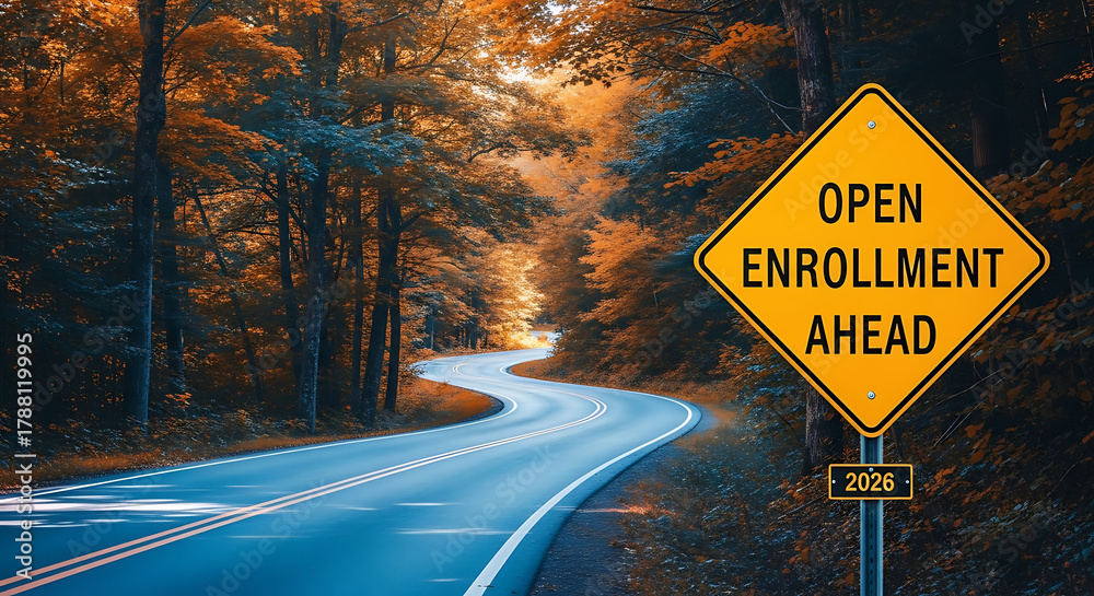 Naklejka premium A winding road through a forest with autumn foliage, leading towards a yellow diamondshaped sign that reads open enrollment ahead