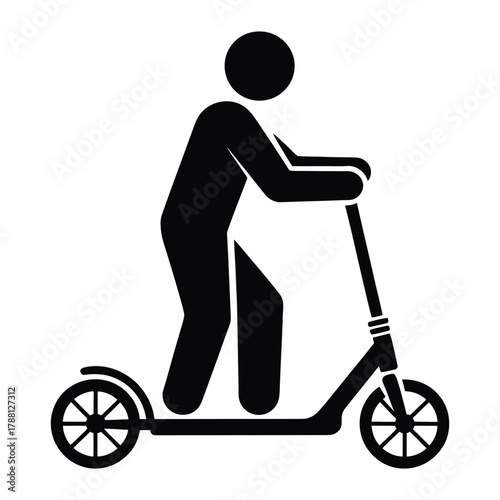 Silhouette of a person riding a kick scooter
