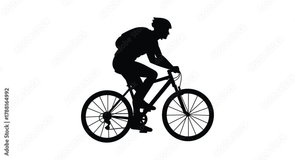 Fototapeta premium Silhouette of a cyclist riding a mountain bike outdoors