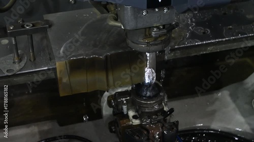 The die insert cutting process by wire EDM machine control by CNC program.