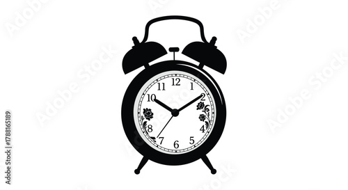 A black silhouette of a classic alarm clock displaying ten forty five