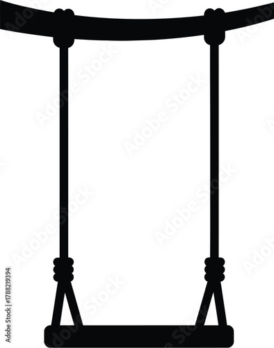 Silhouette of a simple wooden swing hanging from a branch