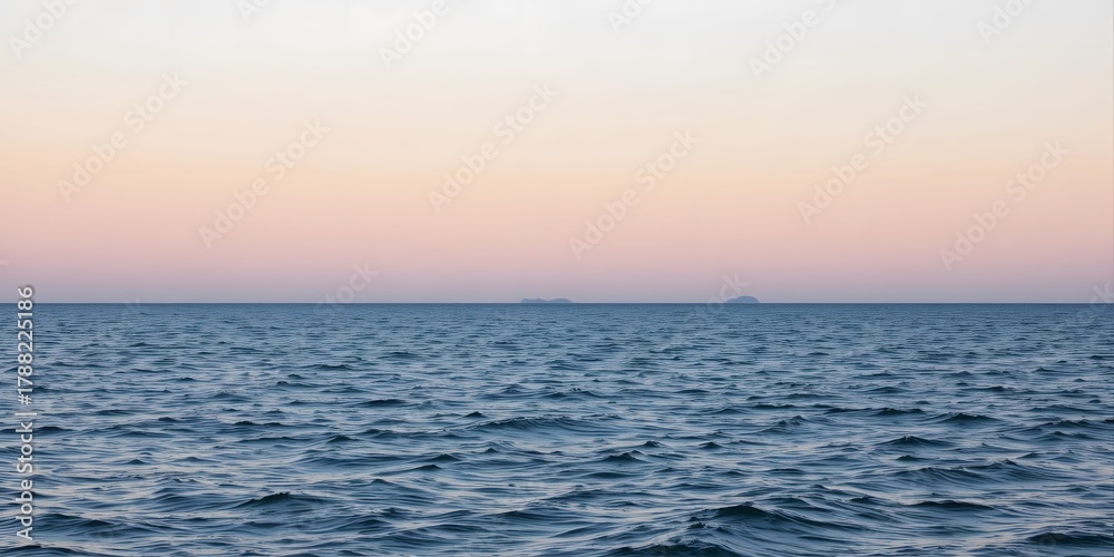 Fototapeta premium Serene Sunset Over Calm Ocean Waves with Horizon in the Distance