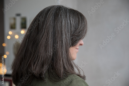 Portrait of a 43-year-old woman with gray hair