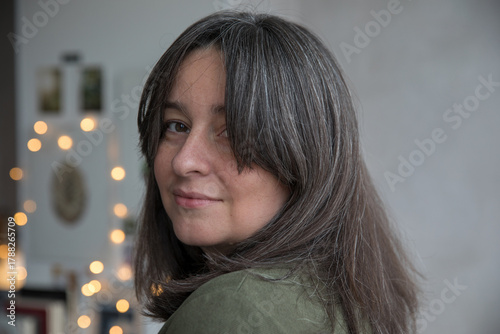 Portrait of a 43-year-old woman with gray hair