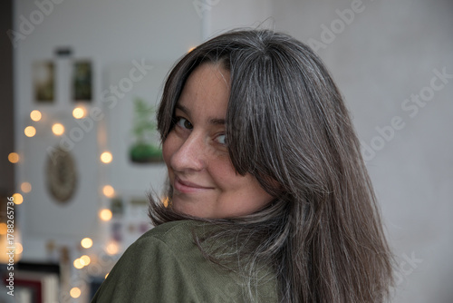 Portrait of a 43-year-old woman with gray hair