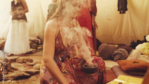 Spiritual healing ceremony, Mystical gathering with aromatic incense, Cleansing ritual held in tipi.