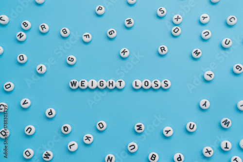 Weight Loss text on light blue background