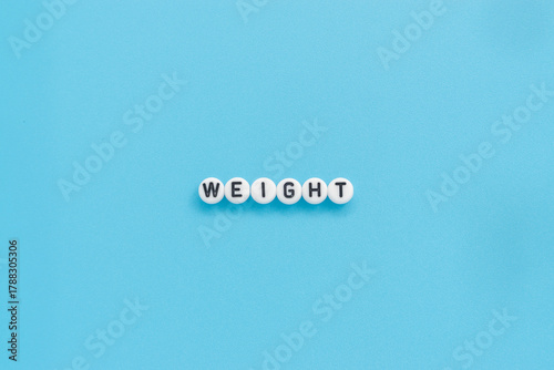 Weight text on light blue background