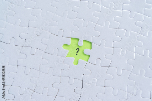 Missing one jigsaw puzzle with question mark symbol