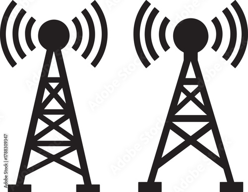 Two radio towers broadcasting signals silhouette