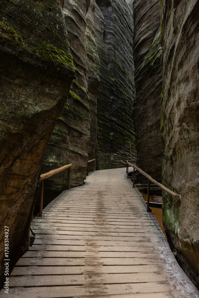 Obraz premium Unusual rock formations. A narrow passageway between rocks. Slot canyon. National Nature Reserve Adrspach-Teplice Rocks.Bohemia region, Czech Republic