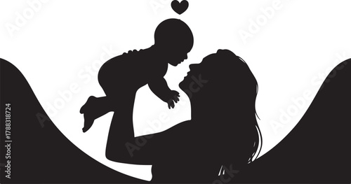 Silhouette of mother holding baby up in front of a heart shape