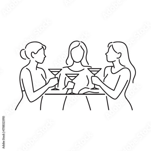 Three women toasting with cocktails at a table