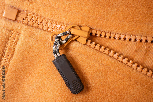 Peach Fabric with Plastic Zipper Pull — Macro Close-Up, Flat Lay