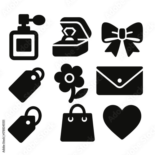 Luxury Gift Icons. Luxury Gift Icons silhouette icon set: perfume, jewelry box, ribbon, clutch, tag, flower, bag, heart.