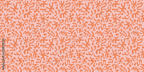 Vector abstract seamless pattern with organic shapes, funky chaotic doodle elements. Groovy childish cut-out texture. Simple pink and orange background. Stylish retro-modern repeat all-over design