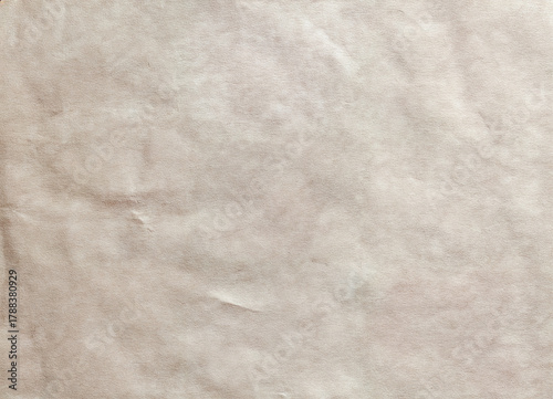 Soft beige paper texture background featuring natural fibers, subtle grain, and warm tone. Ideal for graphic design, packaging mockups, or vintage and craft paper projects.