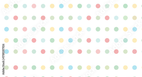 Delicate pastel polka dot array creating a whimsical pattern with soft and gentle hues
