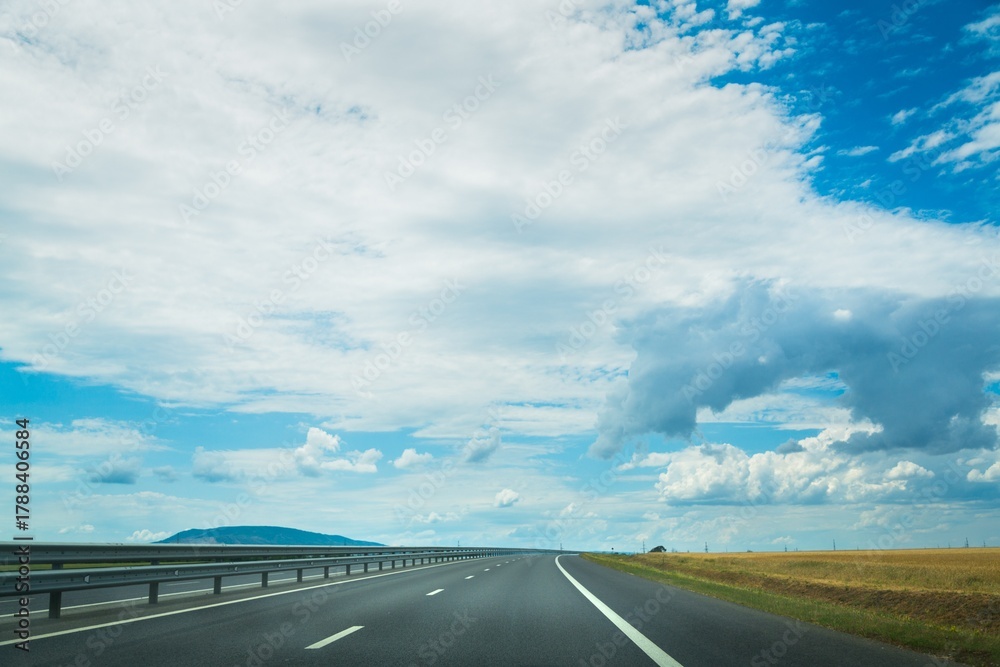 Fototapeta premium Asphalt highway road with blue sky