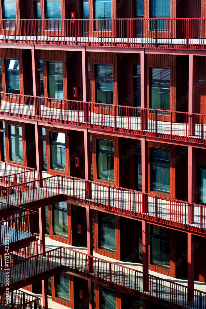 Fototapeta premium Sustainable cabins with natural materials on waterfront in Kvillepiren, Hisingen, sunny day, Gothenburg, Sweden