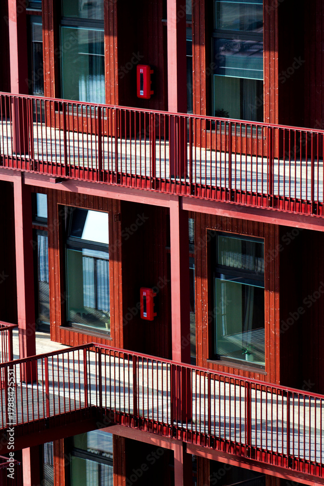 Fototapeta premium Sustainable cabins with natural materials on waterfront in Kvillepiren, Hisingen, sunny day, Gothenburg, Sweden