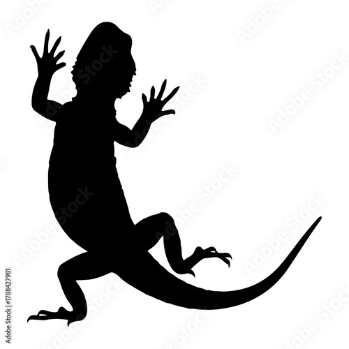 Silhouette of a Bearded Dragon Lizard Climbing Keywords: lizard, reptile, animal, silhouette